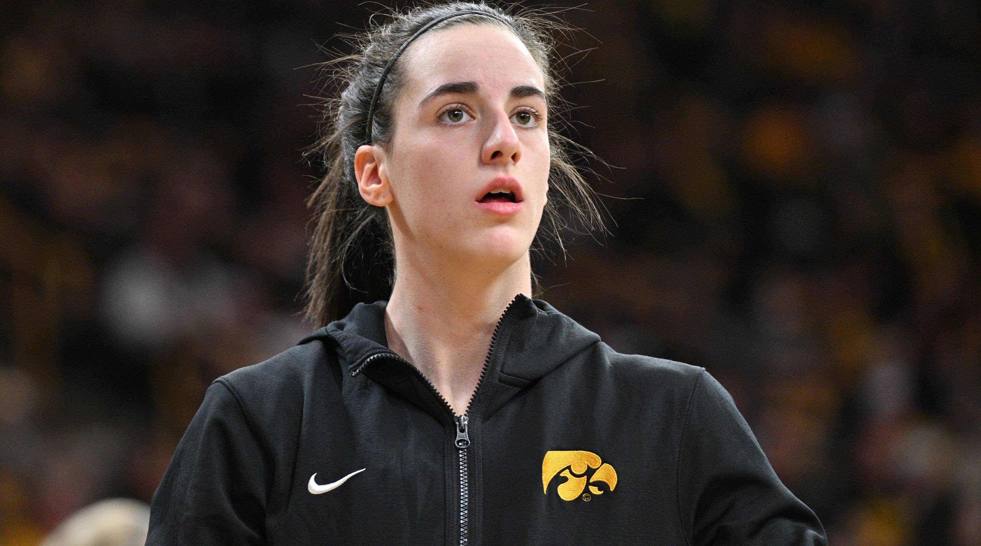 Iowa star Caitlin Clark looks on while warming up before a game.